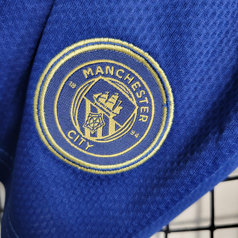 Kit Infantil Manchester City Away 2023/24 - Puma - Azul/Dorada